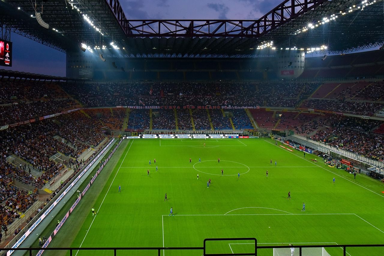 soccer stadium floodlights night match crowd no team crest