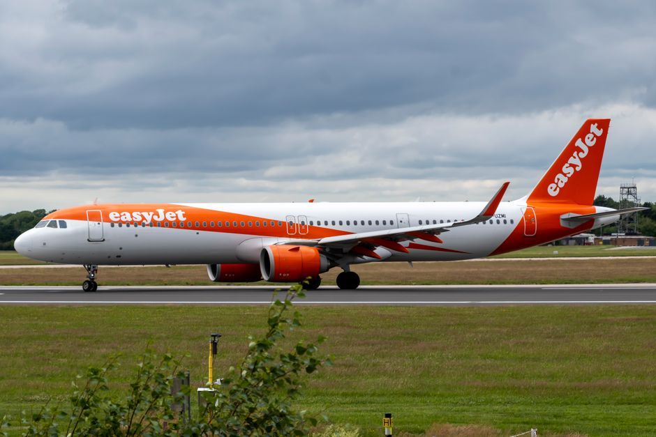commercial airplane taking off UK airport