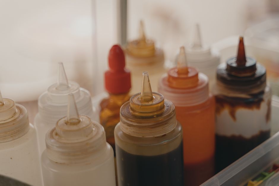 variety of cooking sauces and condiments in a kitchen