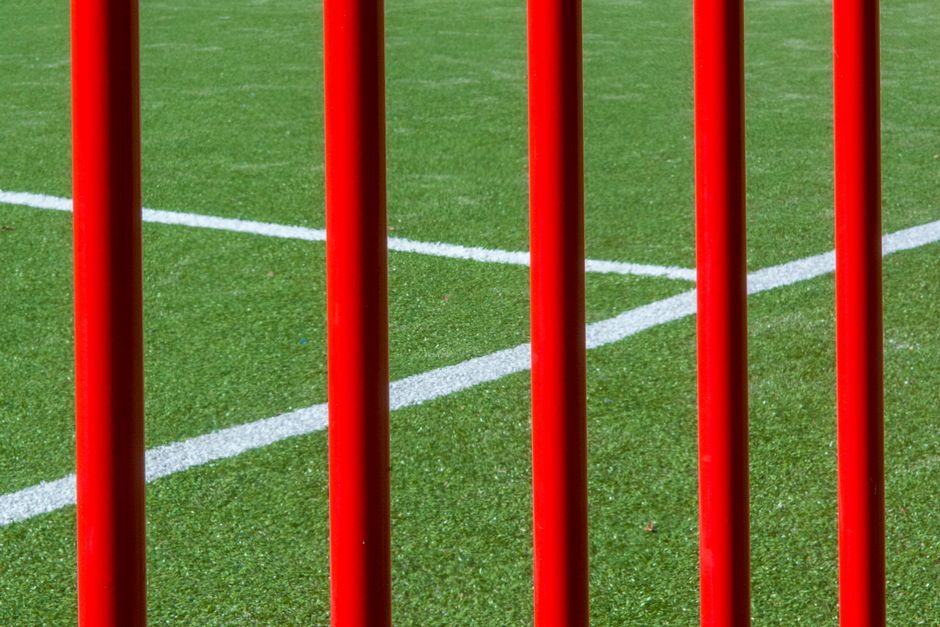 soccer stadium grass pitch close up no team crest