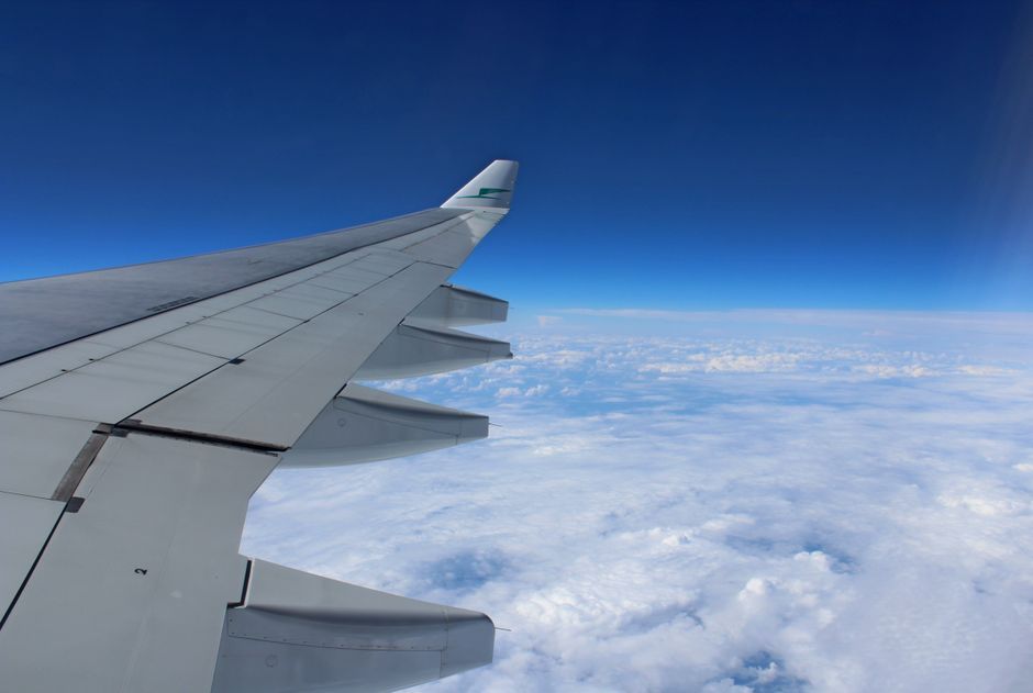airplane wing window view sky travel