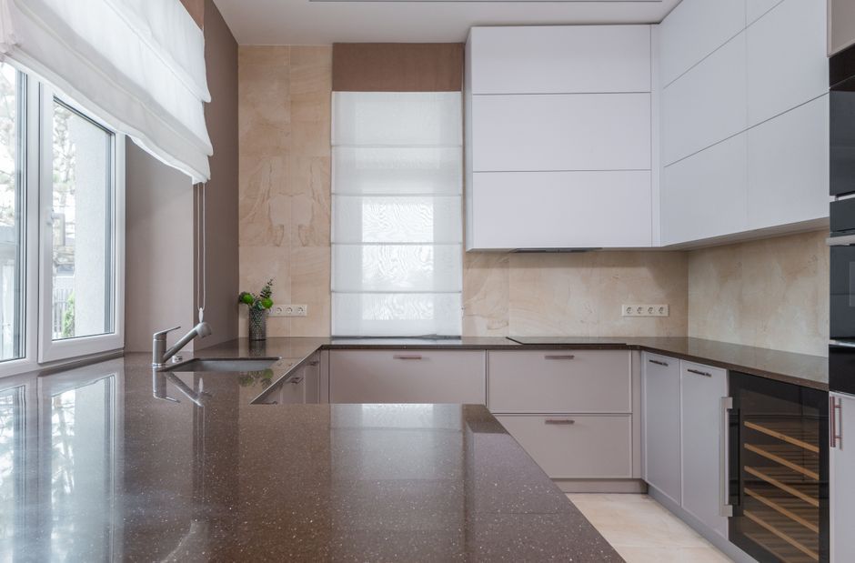 modern kitchen interior butter yellow cabinetry marble countertop
