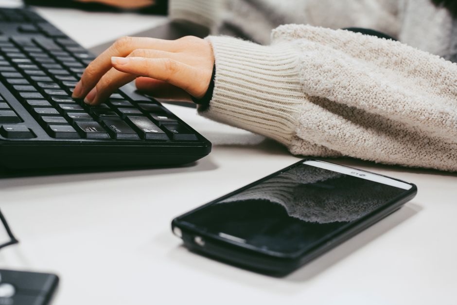 smartphone mobile device typing office desk