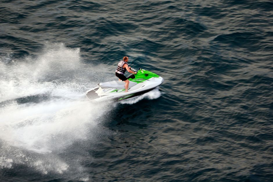 jet ski rider speed spray water splash Thailand