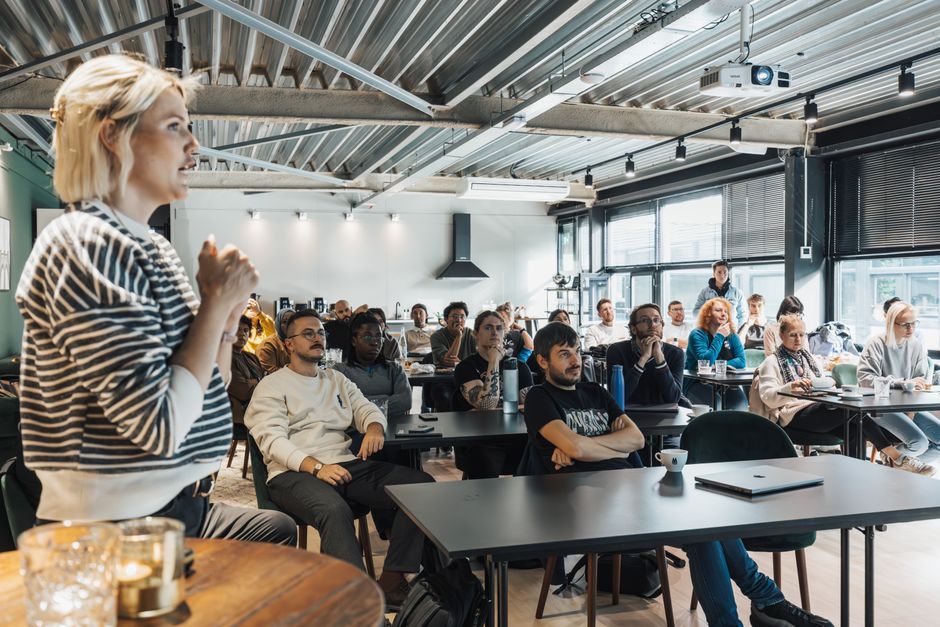 university students listening to a speaker