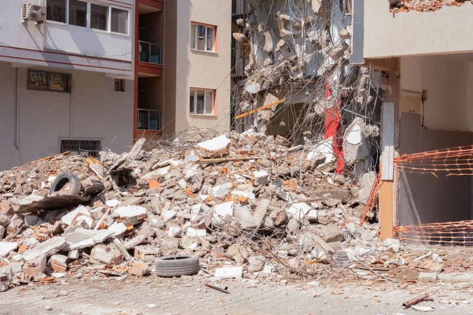 Spain earthquake street debris damage building
