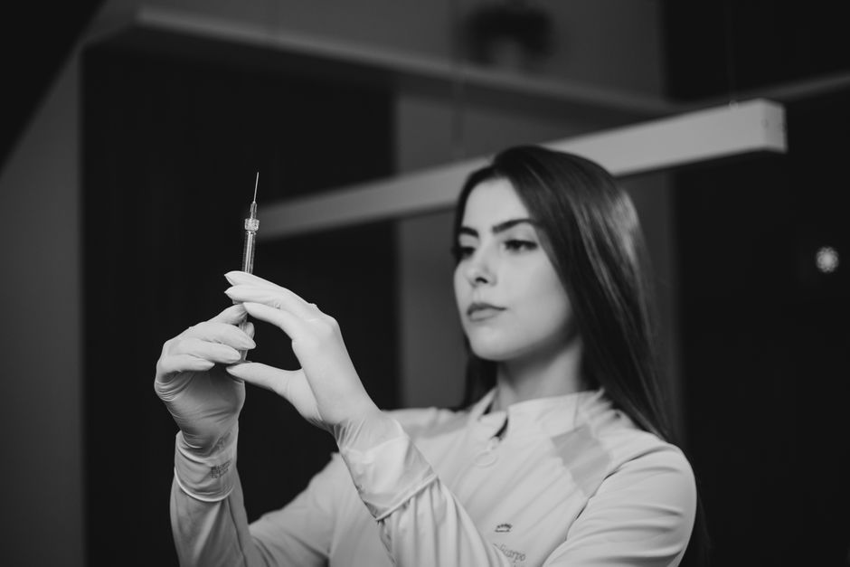 medical healthcare worker preparing vaccine injection