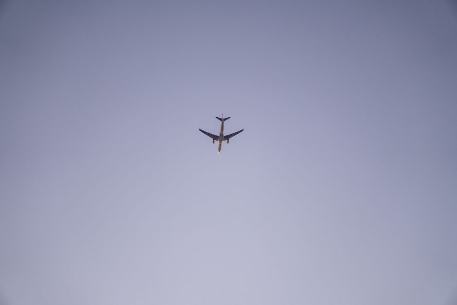 commercial airplane flying in the sky