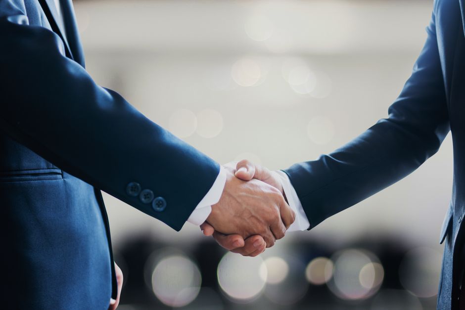 ASEAN economic cooperation handshake