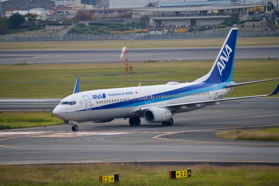Japan Narita airport stranded passengers flooded street