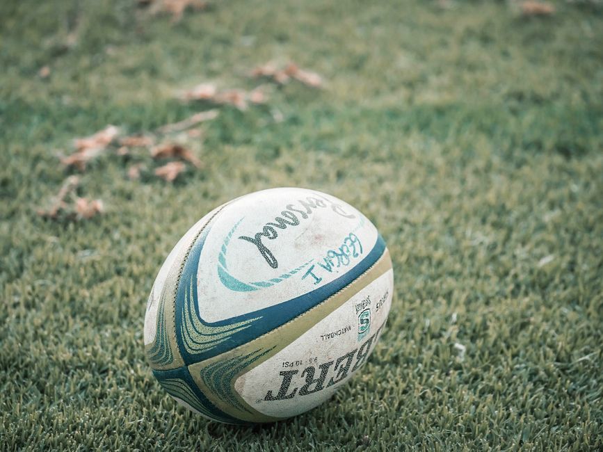historic rugby ball grass field close up
