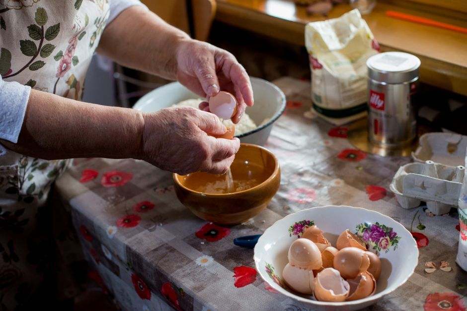 elderly woman cooking kitchen recipe traditional food