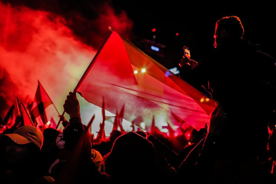 German political supporters crowd flag evening