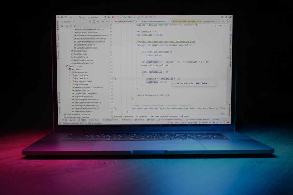 programming code laptop screen dark mode workspace