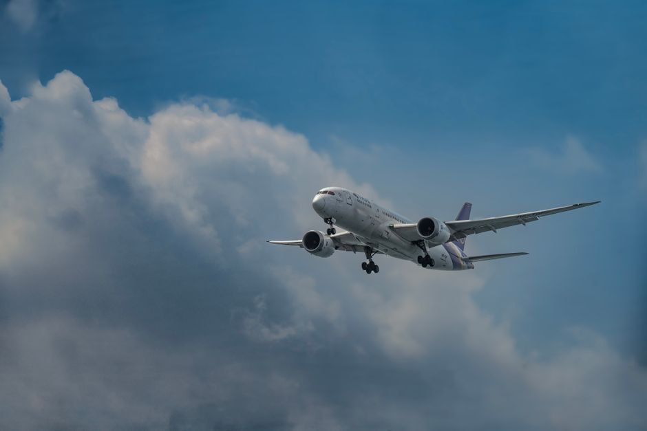 commercial airliner airplane in flight sky