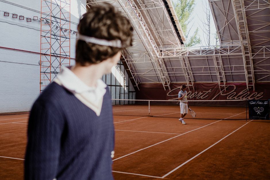 tennis player celebrating victory court