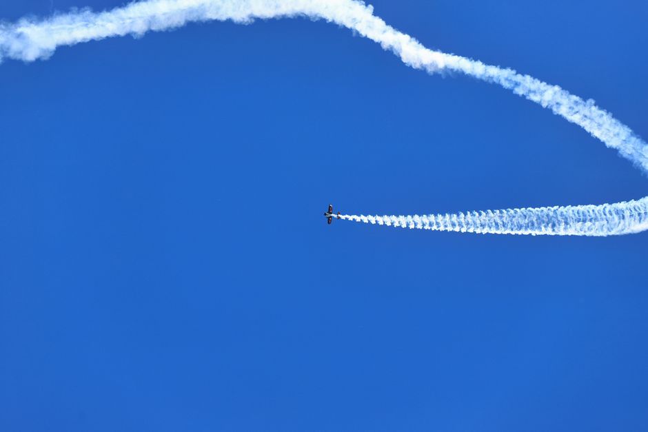 airplane wing contrail sky