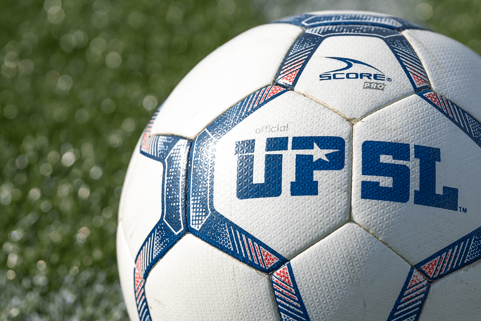 soccer ball grass field close up no logo