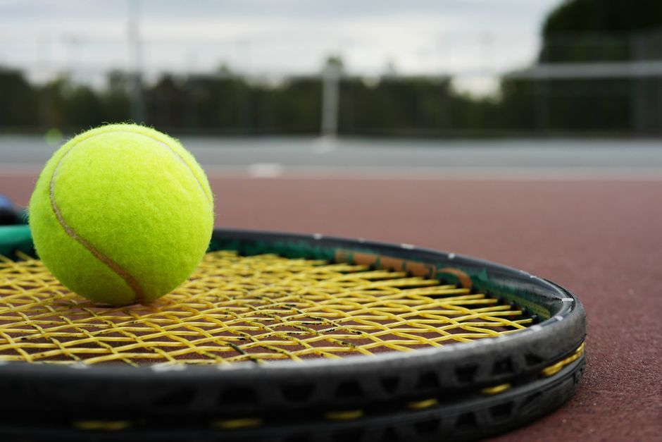 tennis racket balls court close up