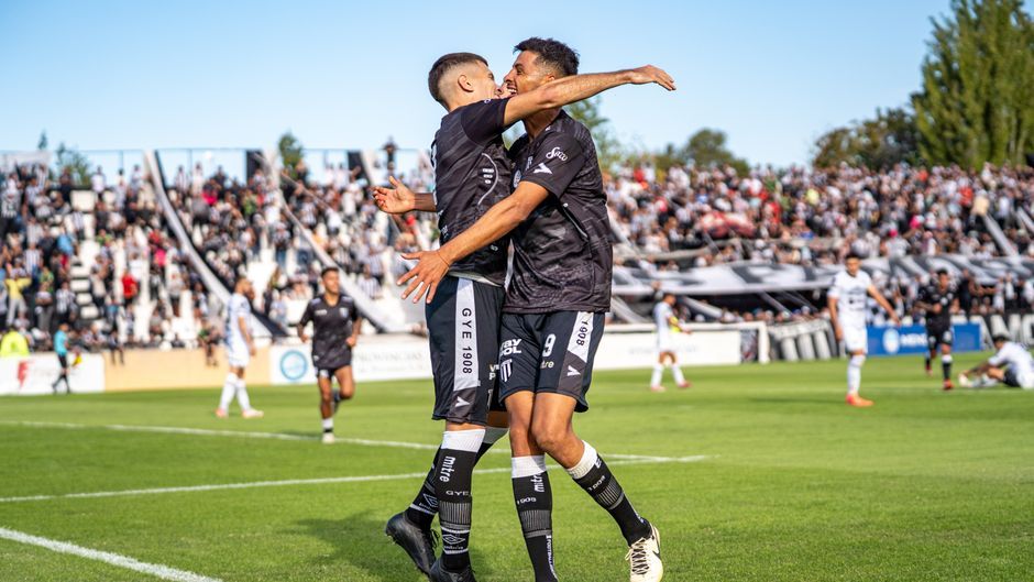 soccer player celebrating goal match stadium no team crest