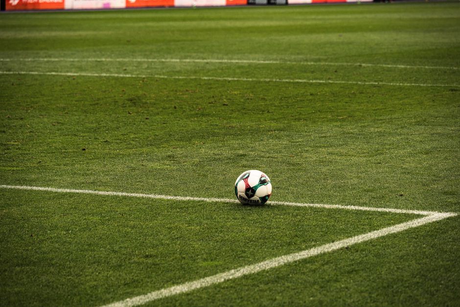 association football match stadium green grass pitch