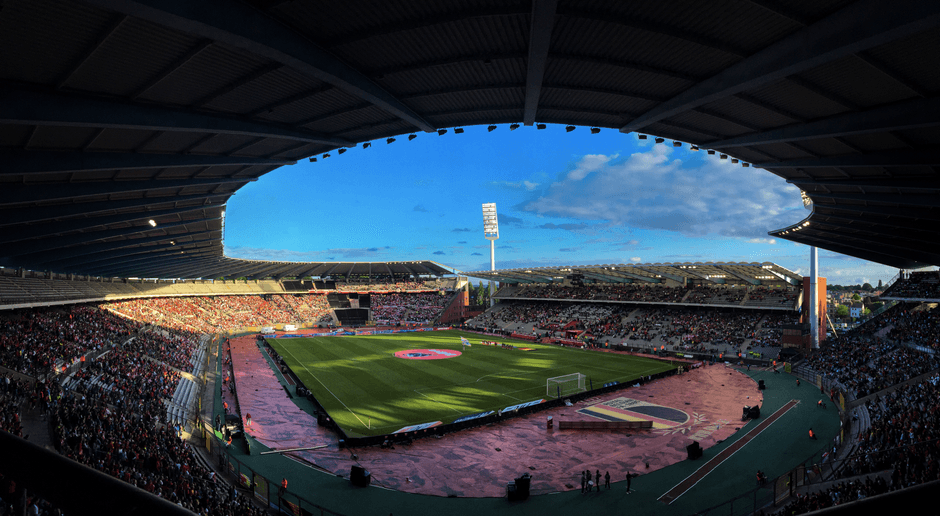 soccer match stadium pitch wide angle no team crest