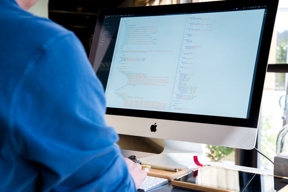 software developer office desk computer coding workspace