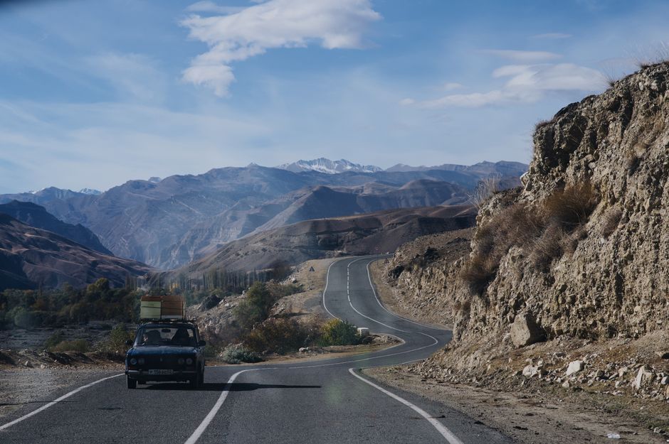 classic Porsche car mountain road trip