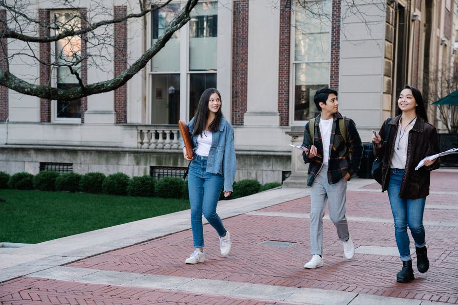 university campus quad students walk daytime USA
