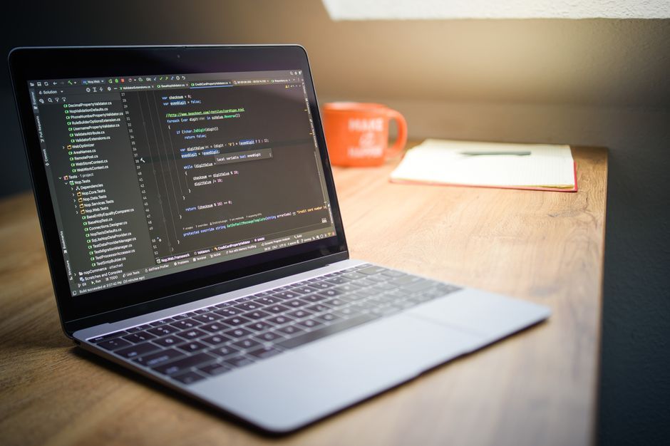 software code development screen office desk
