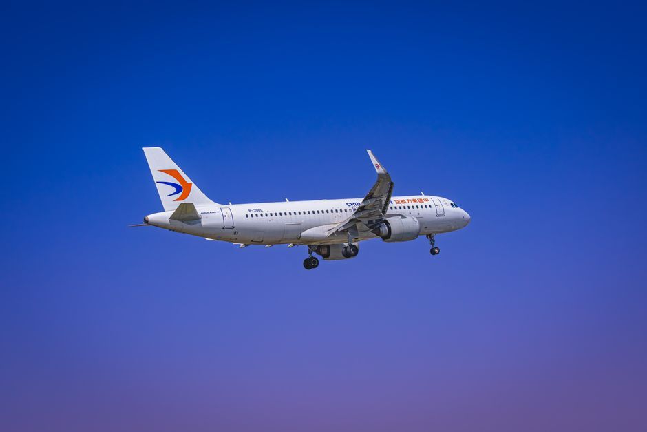 commercial airliner jet airplane flying in the sky