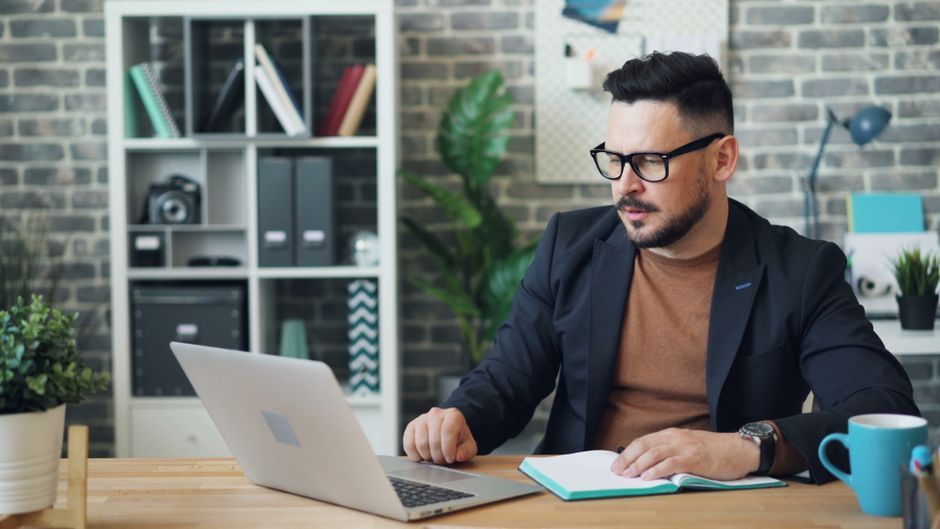 business travel corporate office booking laptop