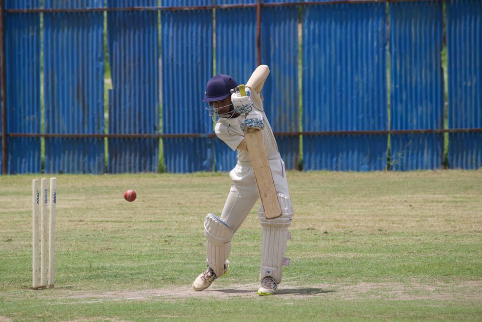 cricket match stadium pitch action