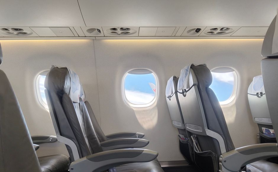 modern airplane passenger seat window view