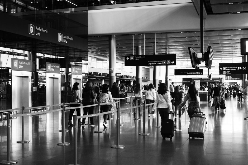 European airport terminal departure board check in queue