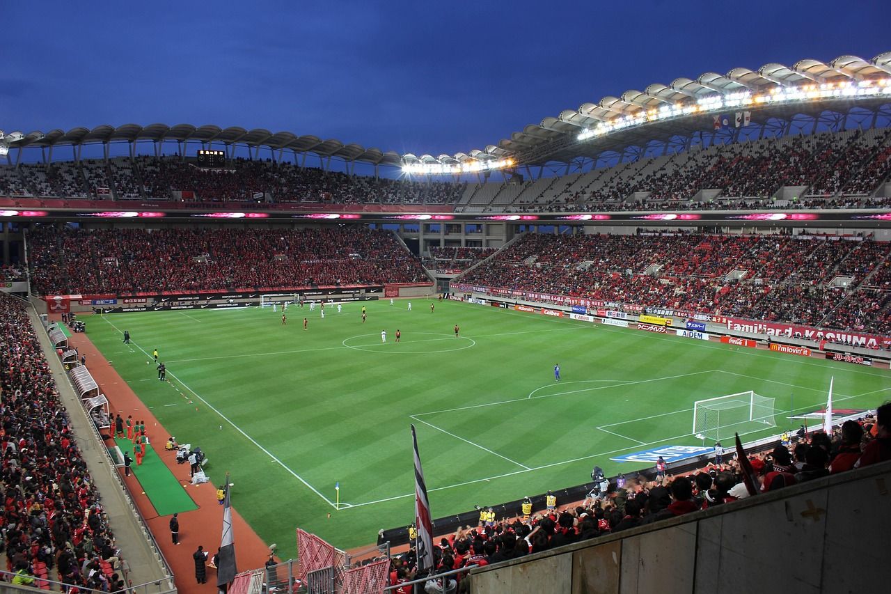 soccer stadium floodlights night match crowd no team crest