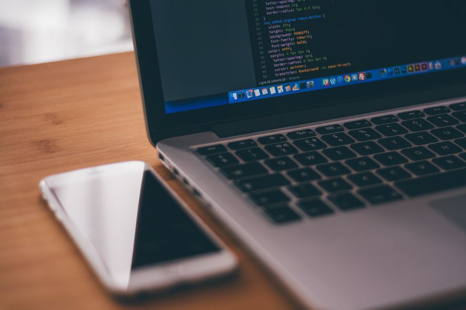 mobile app code debugging office desk