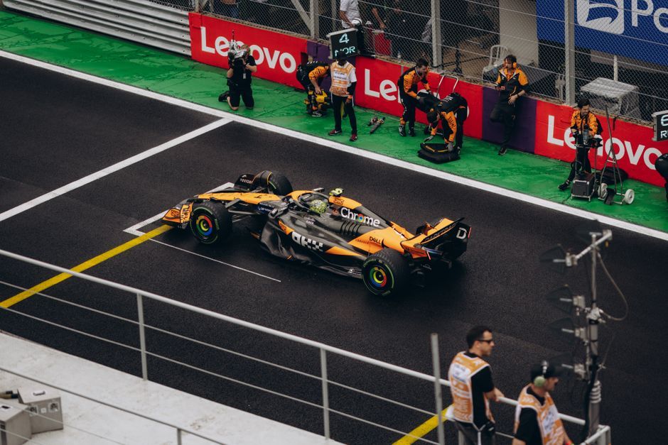 Formula 1 race car pit lane rain