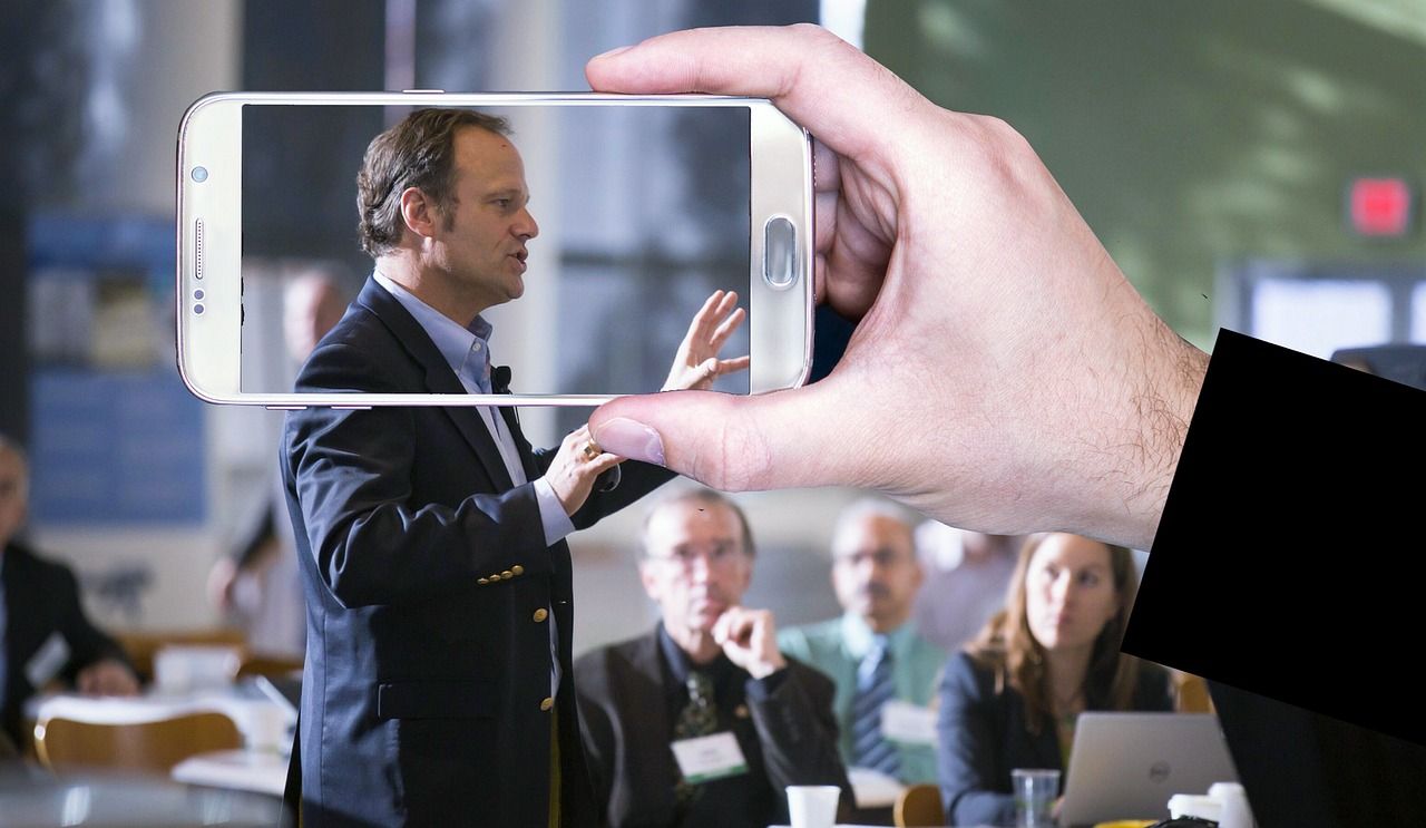 business conference speaker presentation screen daytime