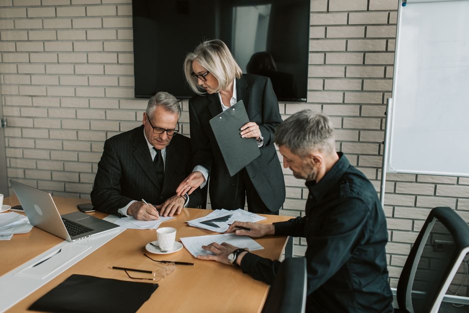 business executives boardroom collaboration discussion strategy office