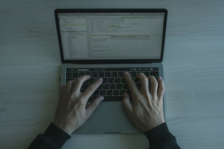 software developer programming laptop screen