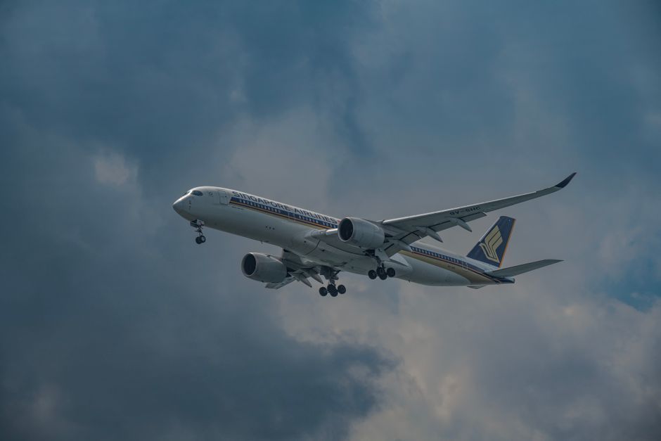 commercial airliner airplane in flight clouds