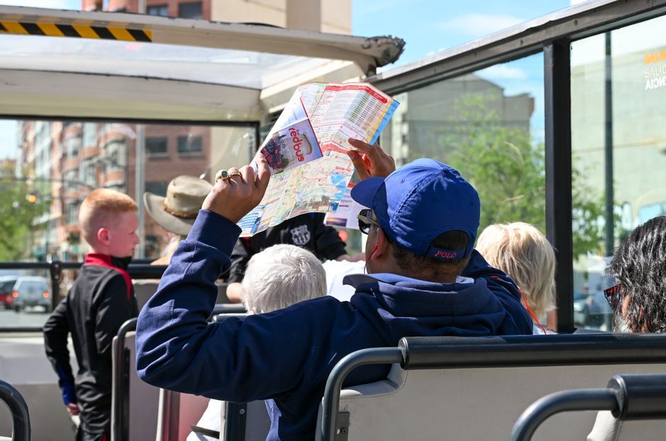tour guide talking to travel group outside