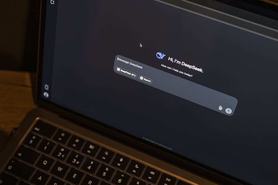MacBook screen typing AI assistant