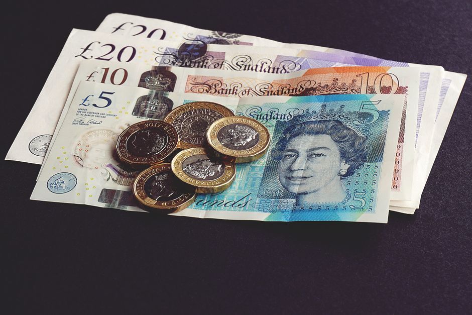British pound currency notes UK bank office workspace