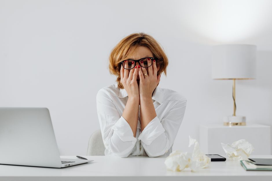 frustrated professional at desk