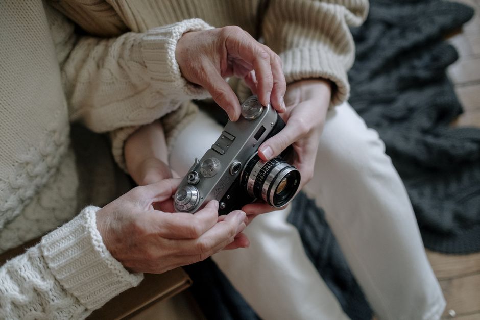 tiny digital camera held in hand retro style