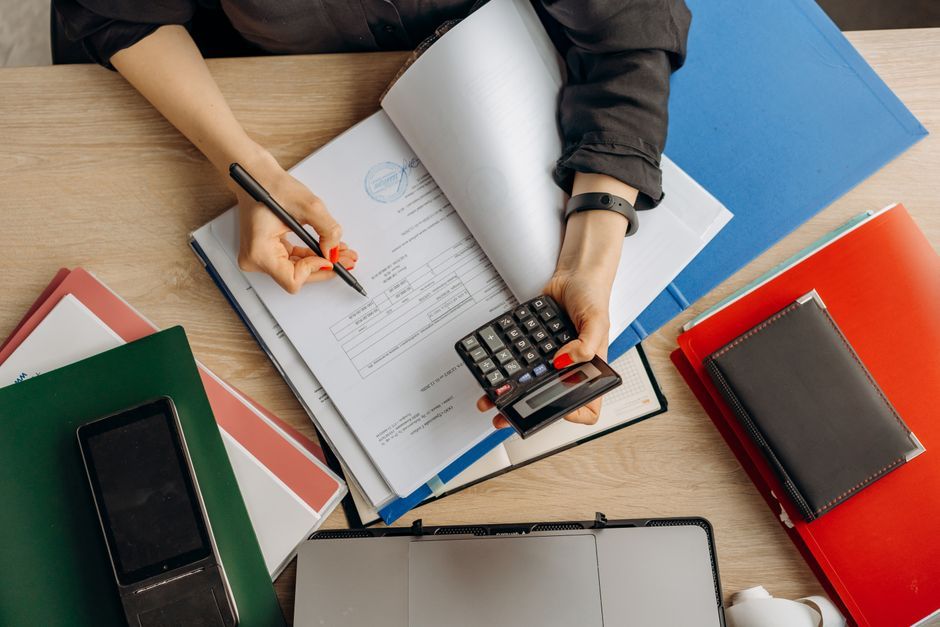 finance spreadsheet calculator notebook computer desk workspace