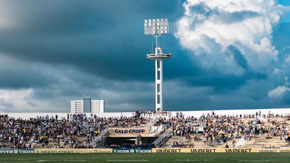 soccer stadium floodlights night match crowd no team crest