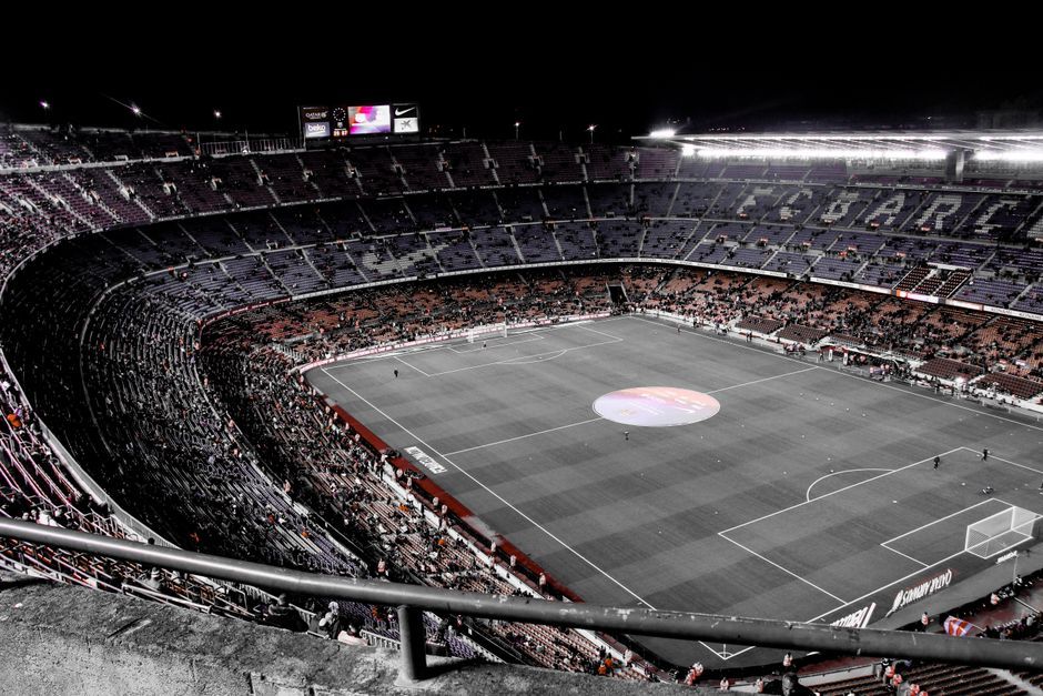soccer stadium floodlights night match crowd no team crest